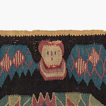 A carrige cushion, 'Bebådelsen (The Annunciation)', tapestry weave, 98 x 45 cm, southwestern Skåne 1801, signed MID.