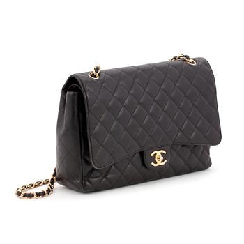CHANEL, a black caviar leather shoulder bag, "Double Flap Maxi".