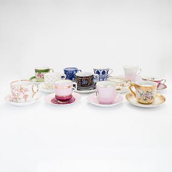 A set of 24 pair of porcelain mustache cups, including Germany, 19th and 20th century.