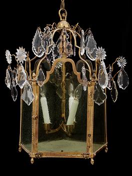 A Russian 18th century Rococo gilt bronze and glass three-light lantern.