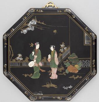 Four black-lacquered wall decorations, China, around 1900.