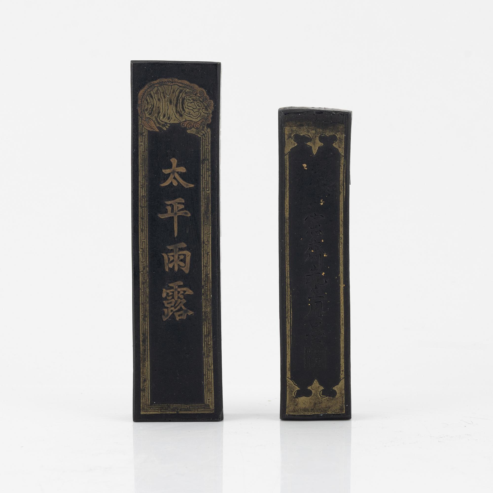 A set of four stone scholars objects and a enameled silver box with cover, Qing dynasty, circa 1900.