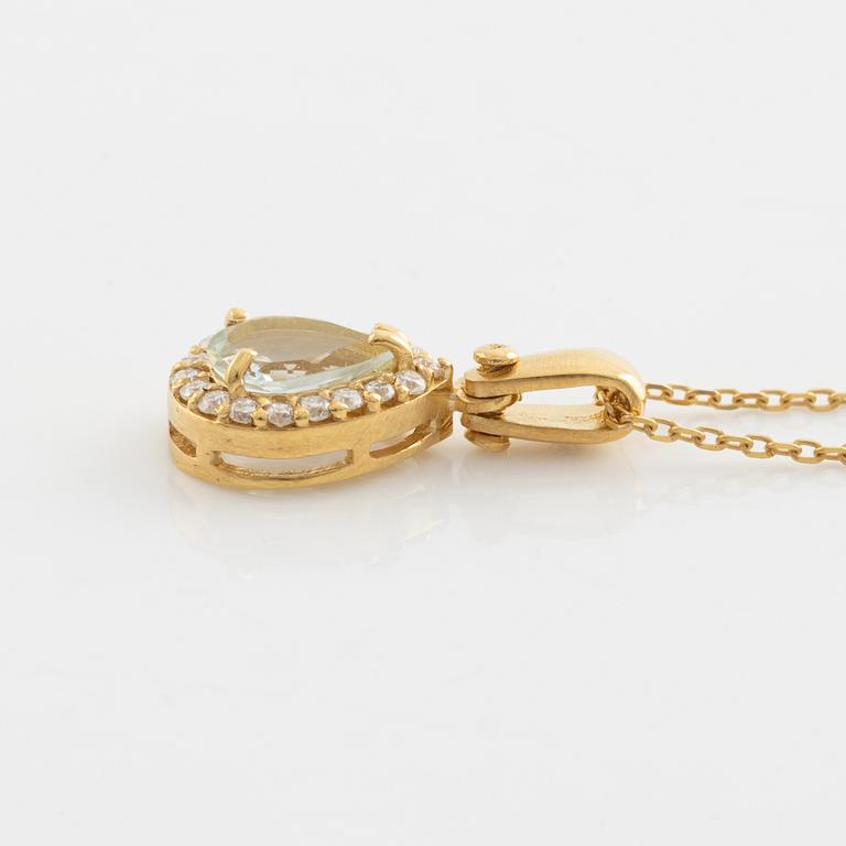 18K gold, light aquamarine and brilliant cut diamond necklace.