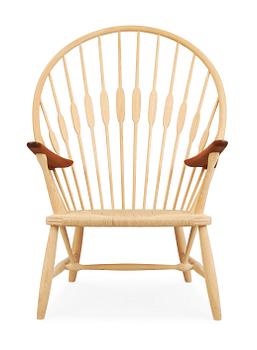 61. A Hans J Wegner ash and teak 'Peacock chair', by PP Møbler, Denmark.