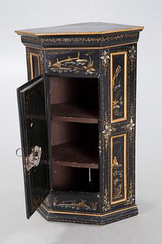 An 18th century corner cabinet.