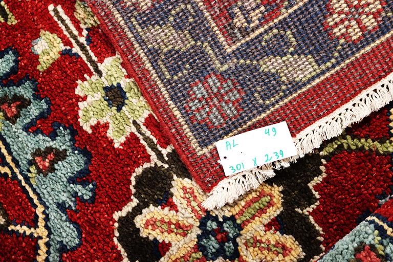 An oriental carpet, c. 301 x 239 cm.