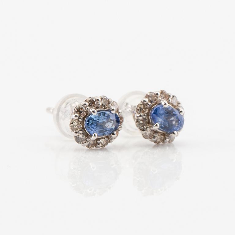 Earrings in 18K white gold with oval faceted sapphires and round brilliant-cut diamonds.