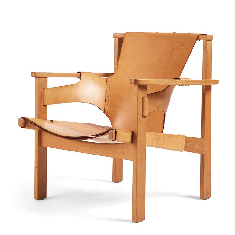 Carl-Axel Acking, a Swedish Modern oak and natural brown leather 'Trienna' chair, Nordiska Kompaniet.