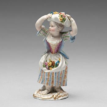 243. A Meissen figure of a girl with flowers, 1890's.