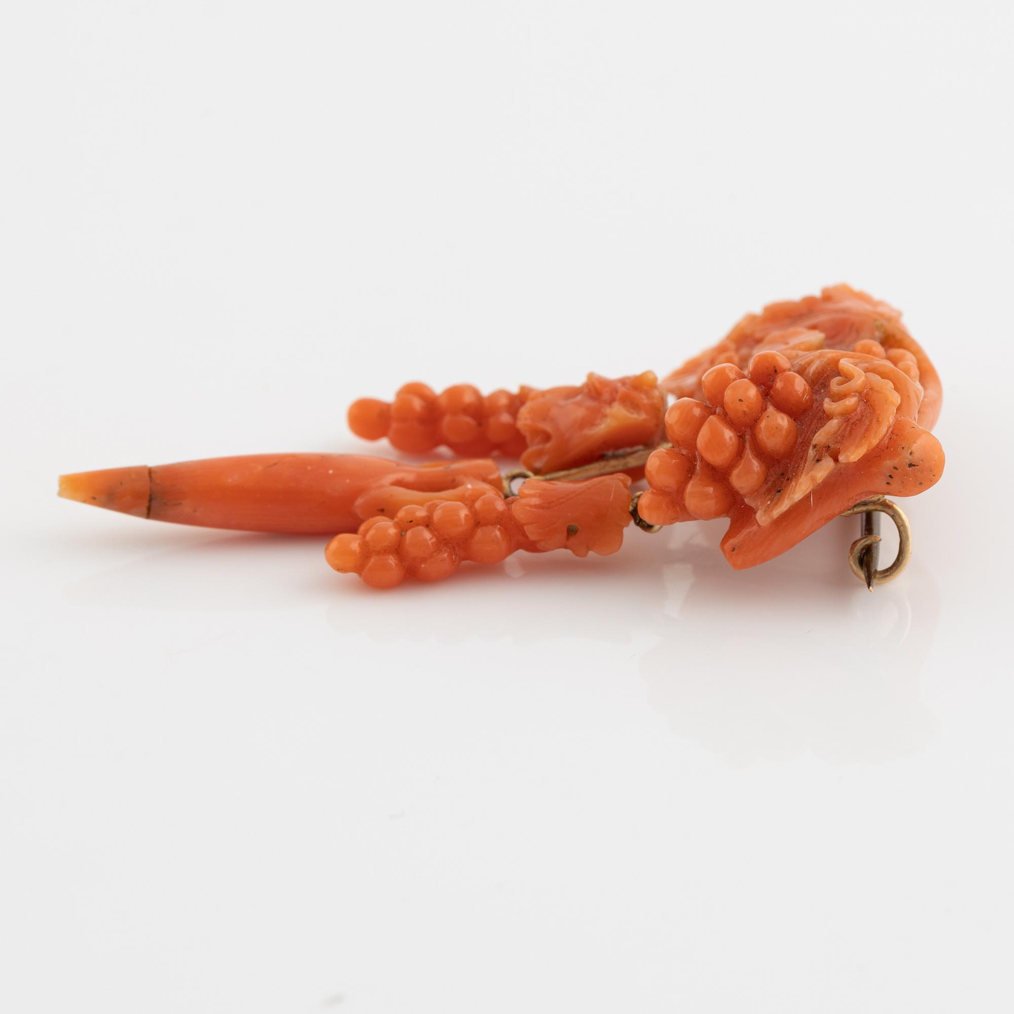 Carved coral brooch. Most likely Italy.