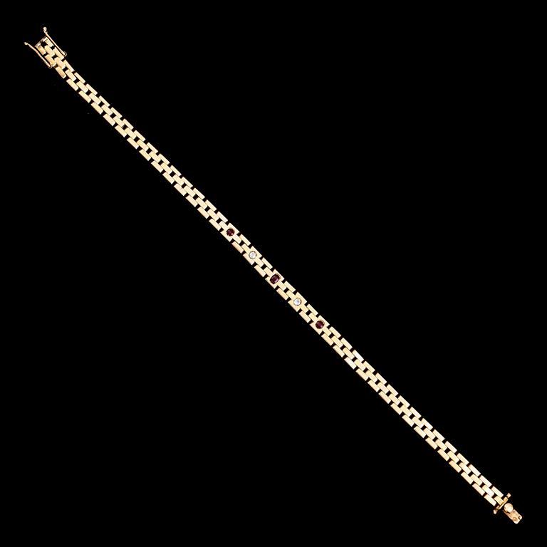 ARMBAND, 14 k guld med röda stenar och diamanter. Vikt ca 14 g.