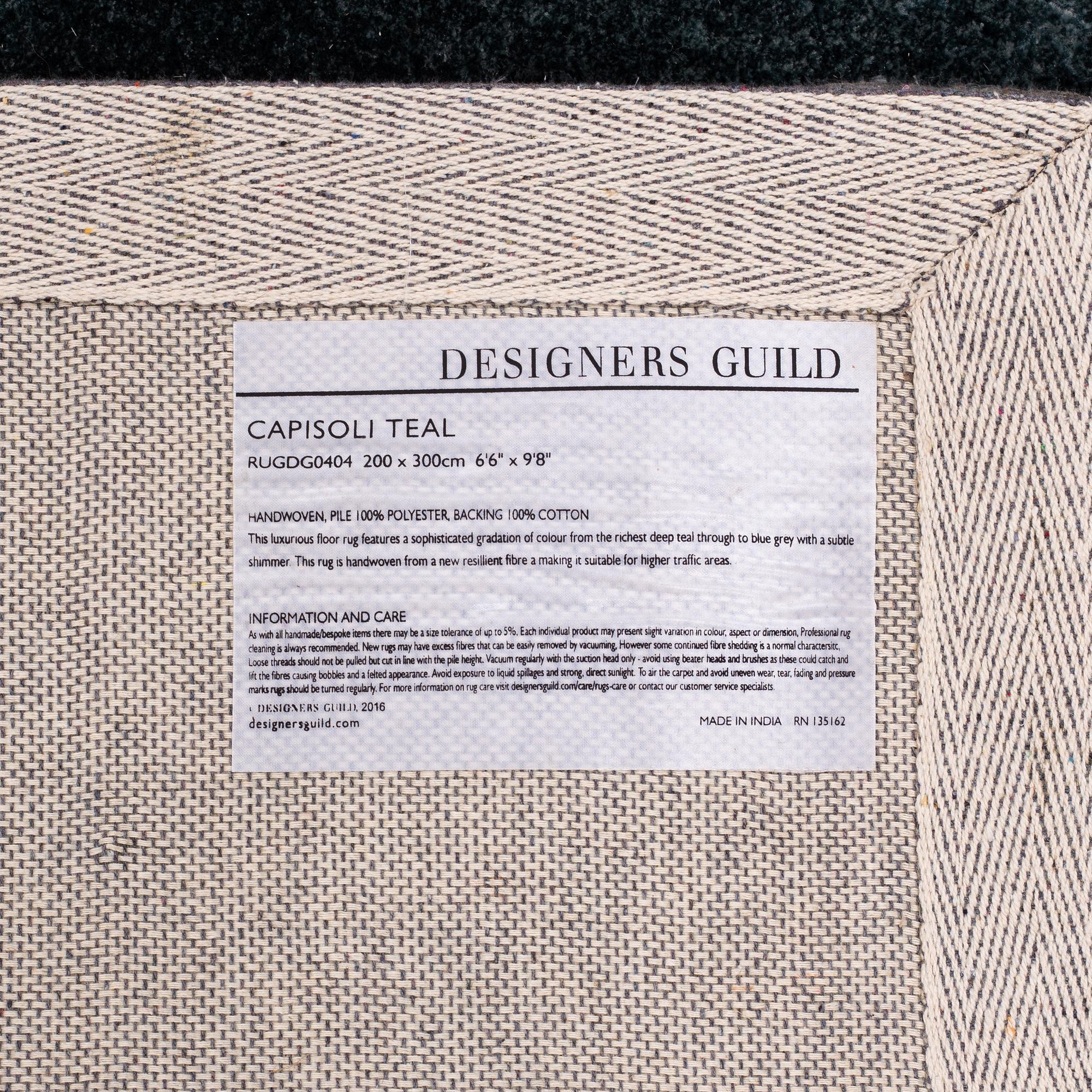 A Designers Guild carpet 'Capisoli teal', ca 205 x 300 cm.