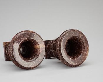 A pair of Swedish first half 19th century porphyry urns.