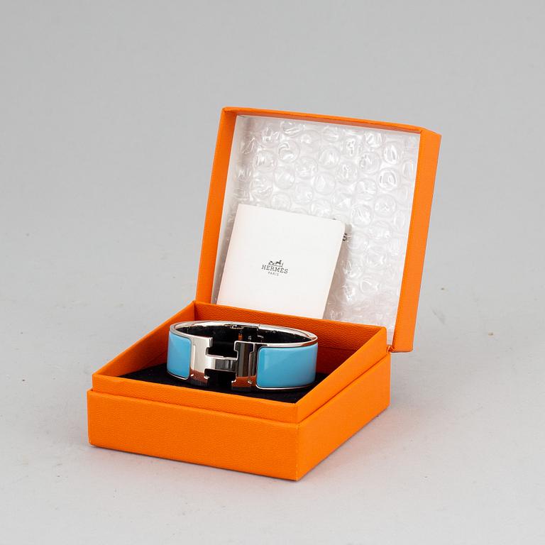 HERMÈS, a 'Clic H' bangle.