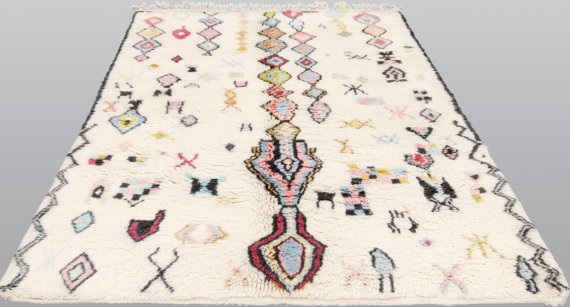 A Moroccan rug, approx. 253 x 166 cm.