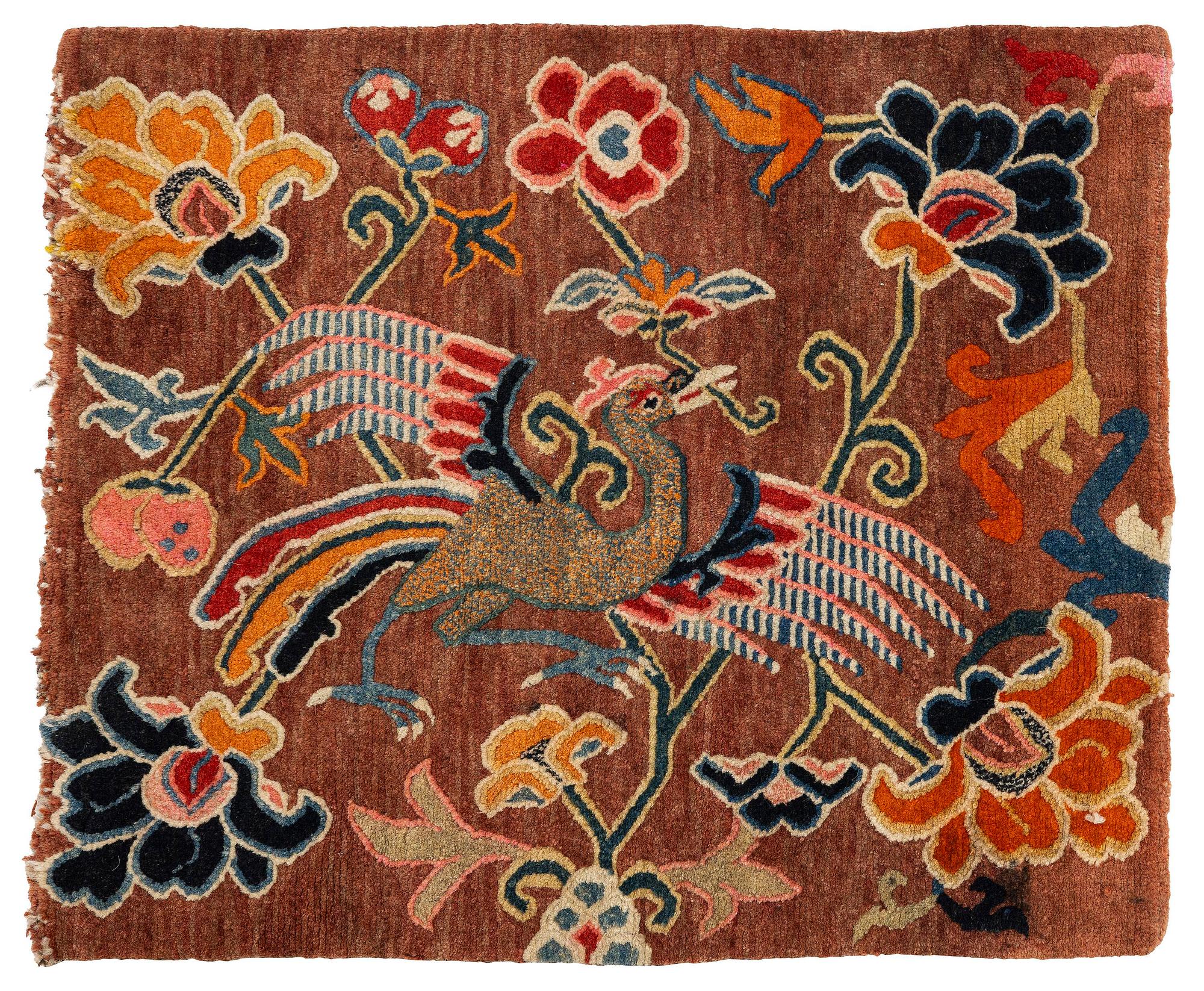 An antique 'Khagangma' rug, Tibet, around 1900. c. 74x63 cm.