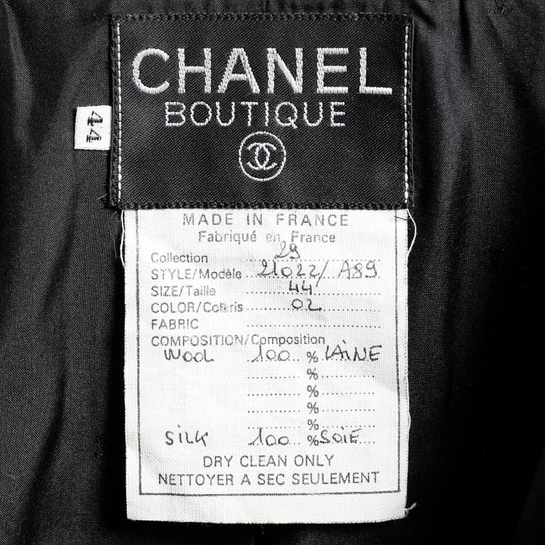 CHANEL, a two-piece suit consisting of jacket and skirt.