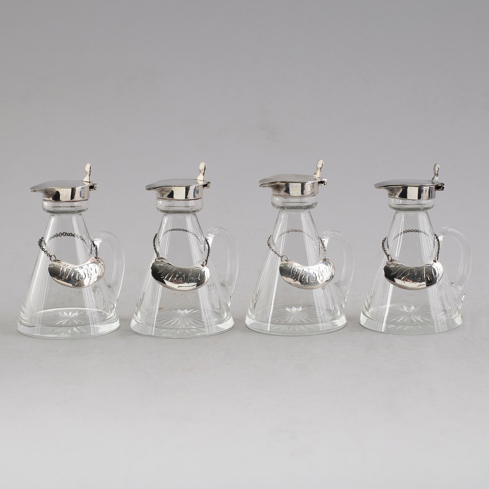 WHISKYKARAFFER, 4 st, glas med silverlock och etiketter, Birmingham 1929.