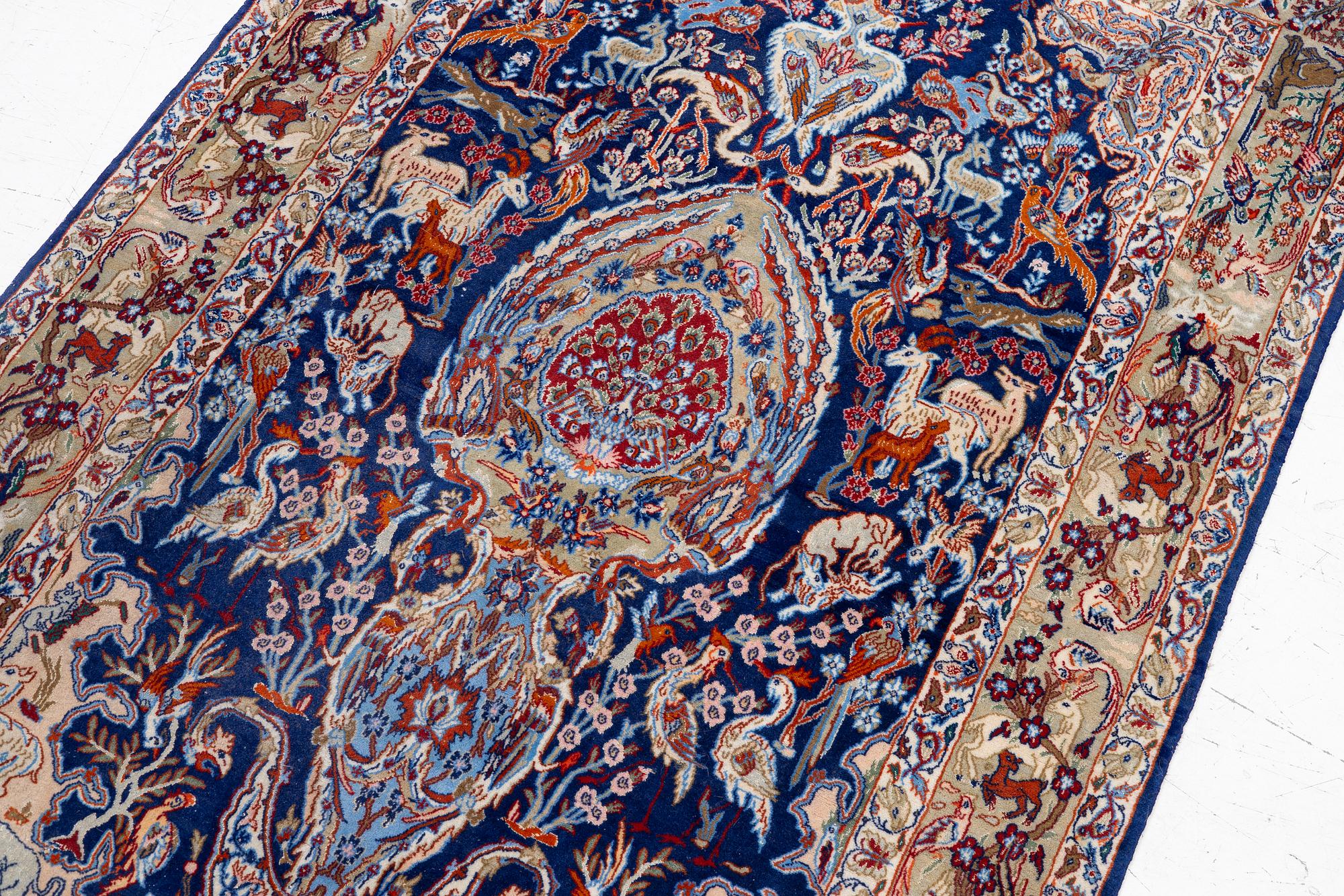 An oriental, figural, signed rug, c. 162 x 104 cm.