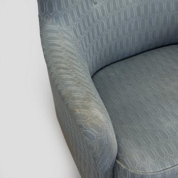 A pair of mid-20th century armchairs.