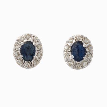 Pendant and a pair of earrings, white gold with sapphires and brilliant-cut diamonds.