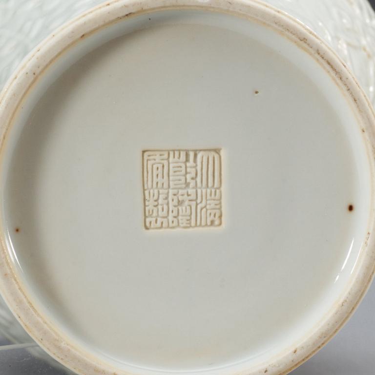 A white glazed vase, Qing dynasty with Qianlong seal mark.