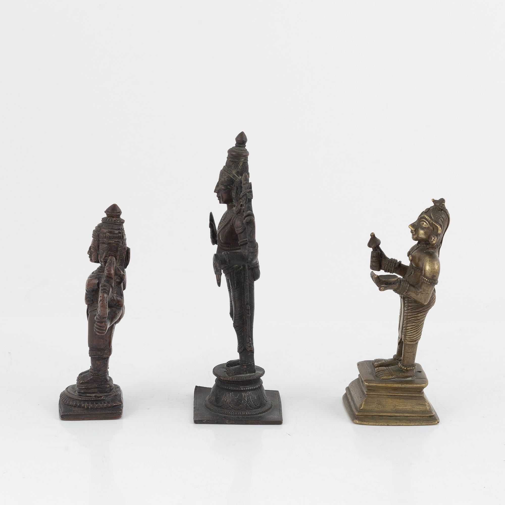 A group of three Indian bronze figures and an ewer, 20th century.