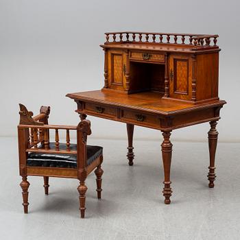 A late 19th century writing desk and armchair.