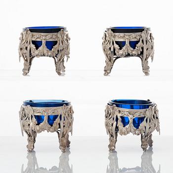 A set of four French silver and blue glass salt-cellars, mark of GA Jacob, Paris 1778.