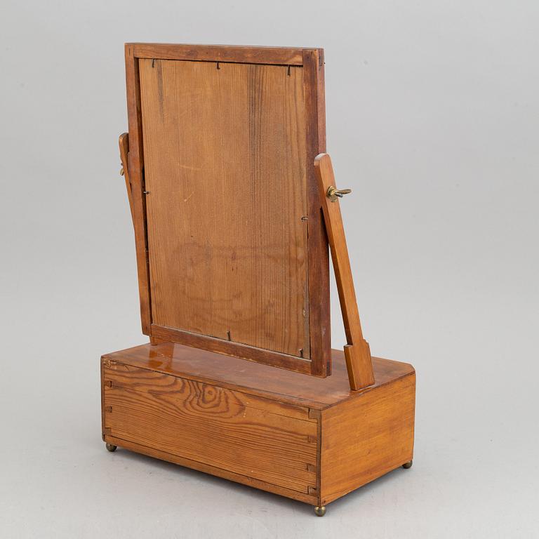 An Empire table mirror, first half of the 19th century.