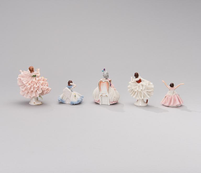 A set of five Dresden porcelain figurines in lace dresses. Mid-20th century.