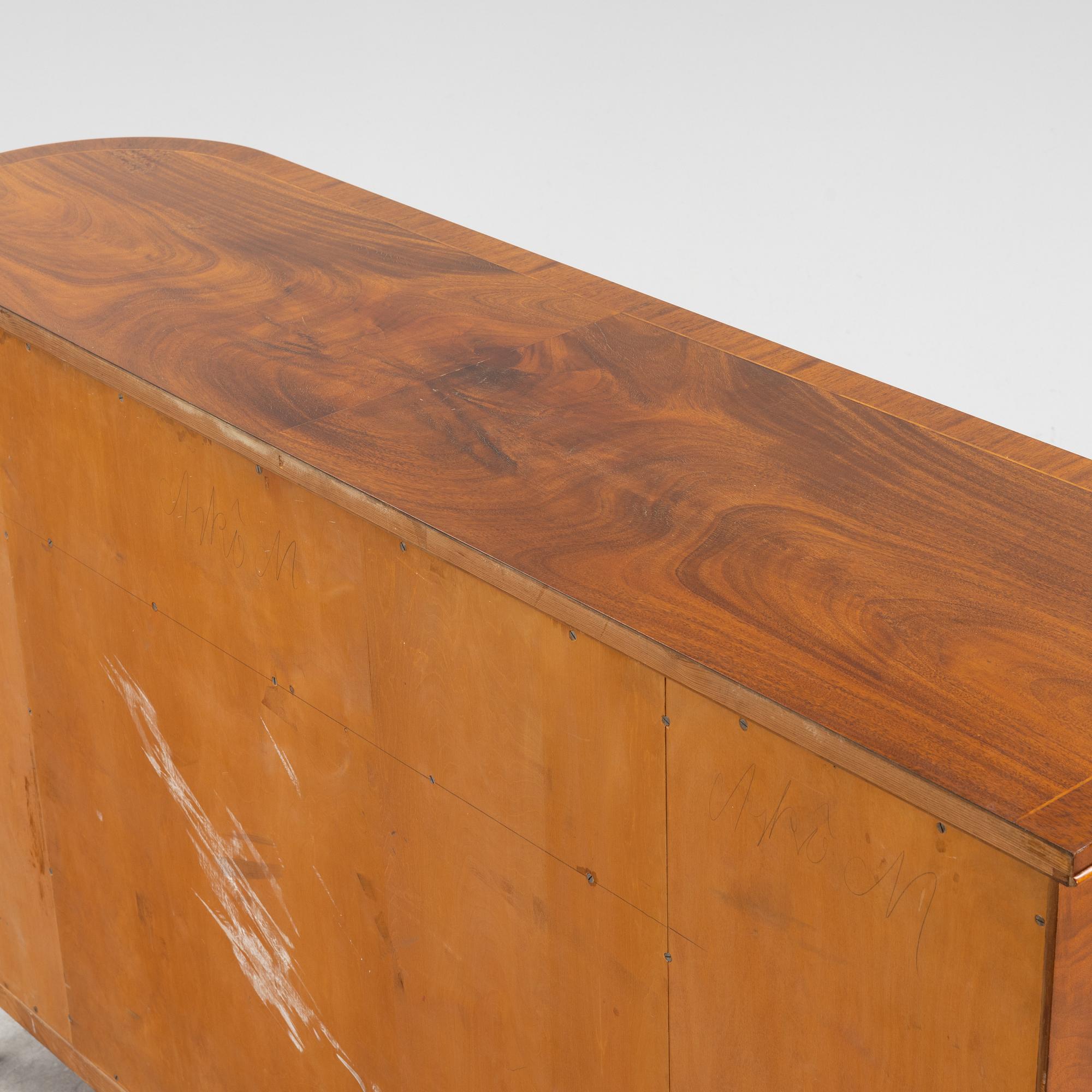 A 1940s mahogany veneered cabinet.