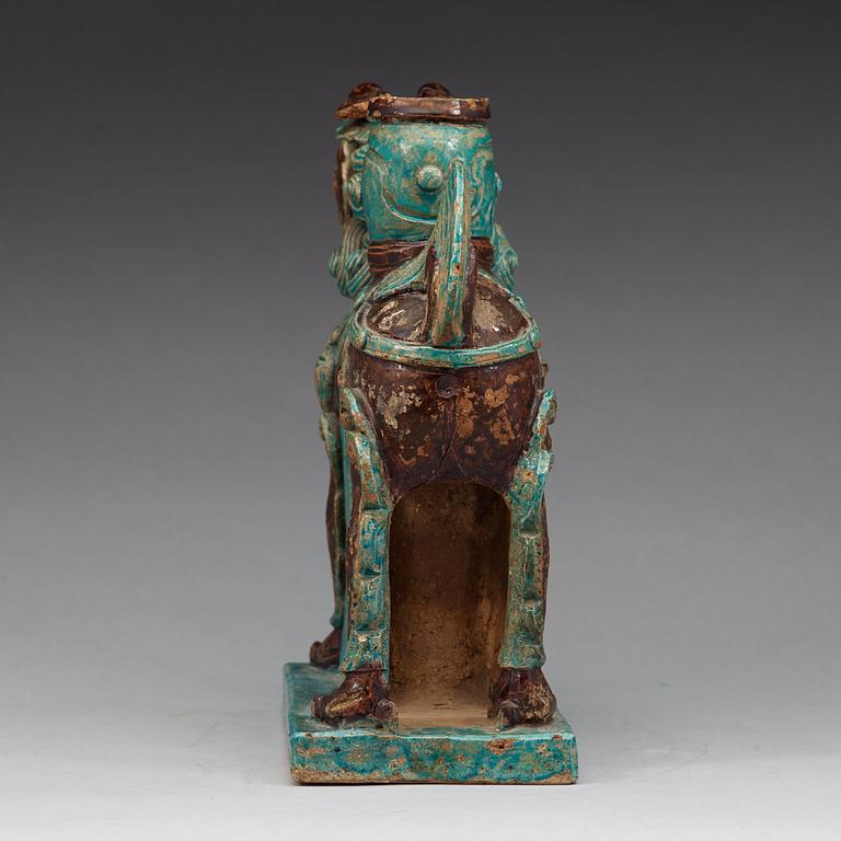 A turkoise and aubergine glazed figure of a Mythical beast, late Ming dynasty (1368-1644).