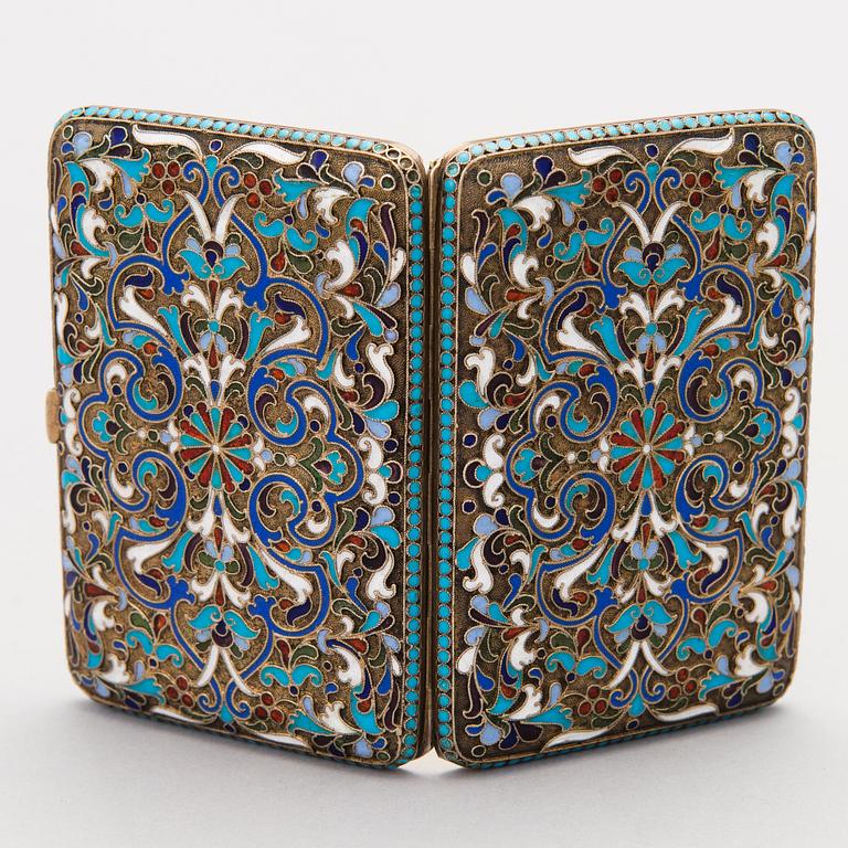 A Russian enamelled parcel-gilt cigarette case by Nikolai Zverev, Moscow 1908-1917.