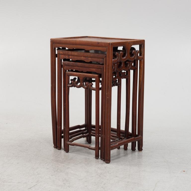A three-piece hardwood nesting table, China, late Qing dynasty.