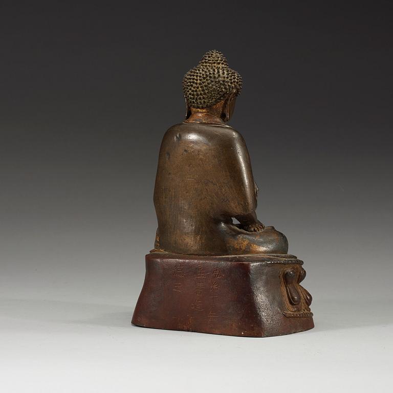 A gilt bronze figure of Buddha Sakyamuni, Ming dynasty (1368-1644).