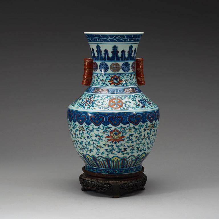 A doucai vase with bamboshaped handles, Qing dynasty, 19th Century, with Qianlong seal mark.