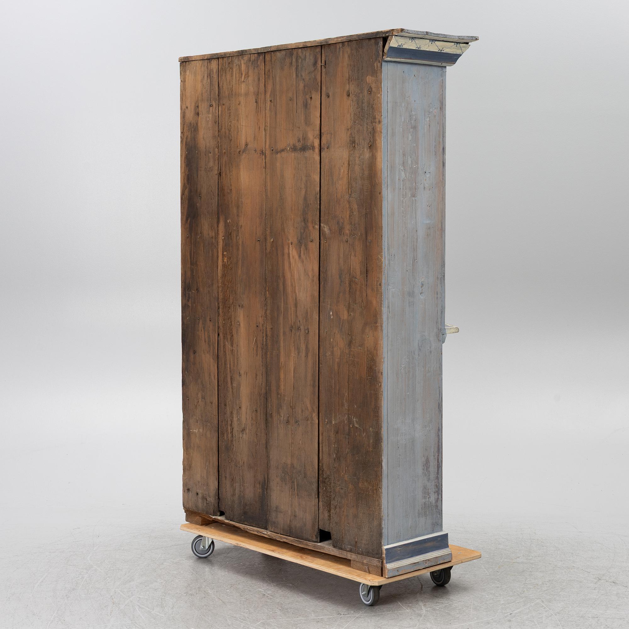 A painted folk-art cupboard, early 19th century.