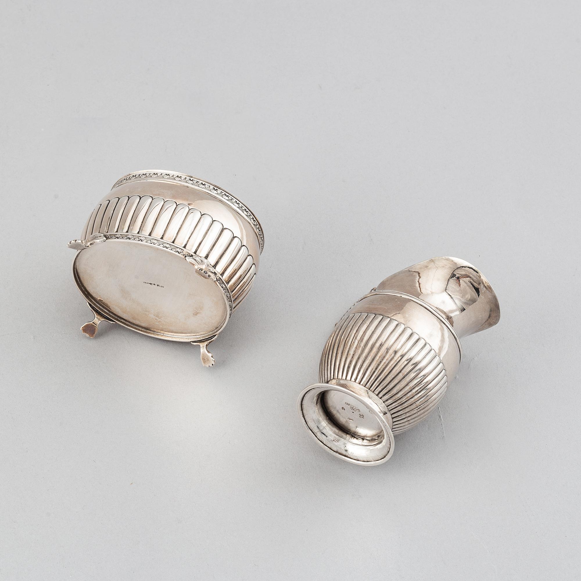 A silver creamer by Johan Petter Ahlforss, Strängnäs, 1833 and a silver sugar box, Kristianstad, 1928.