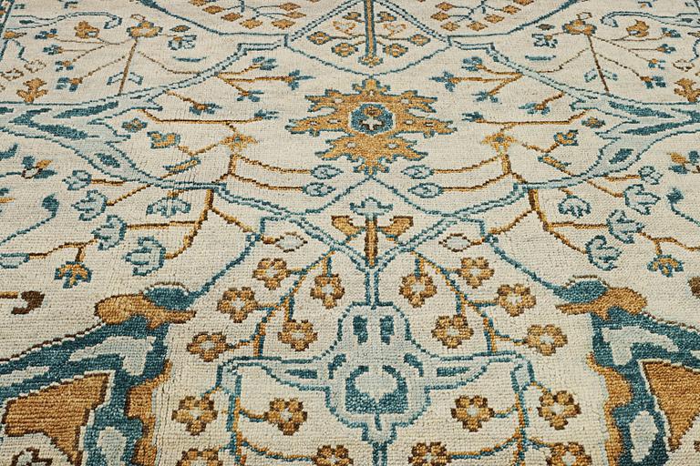An oriental carpet with Mamluk design, c. 302 x 234 cm.