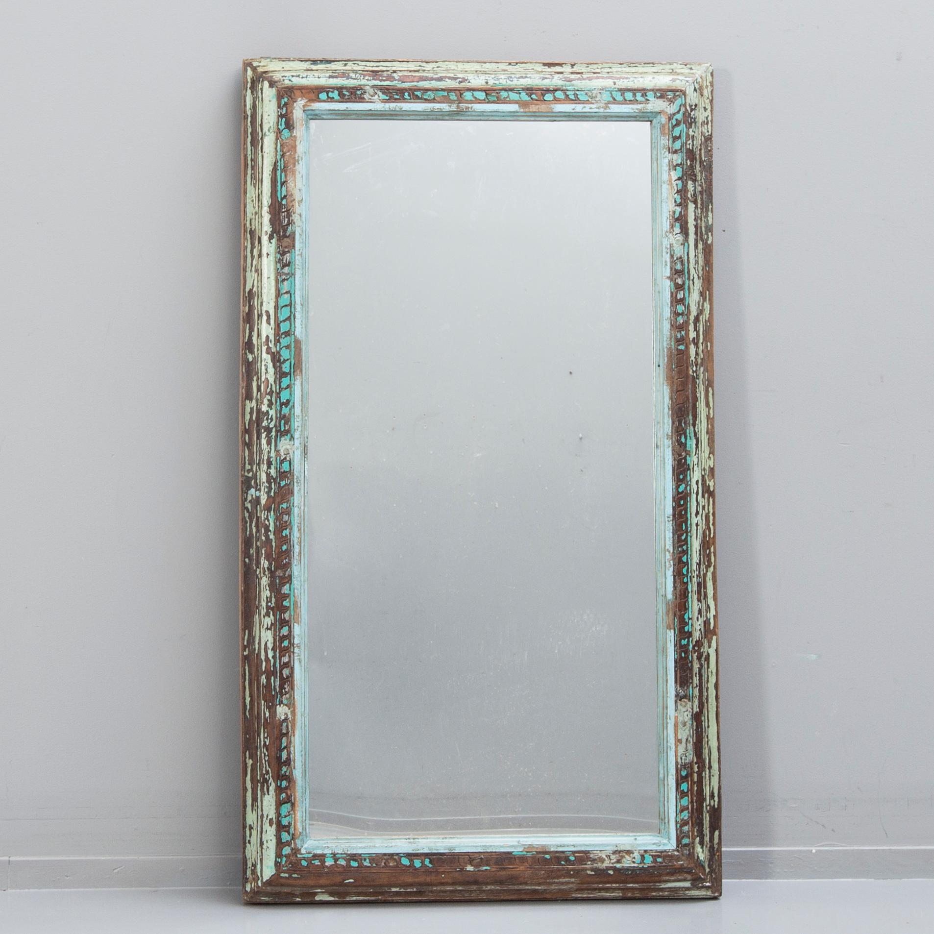 An Indian panted wood mirror 20th/21st century.