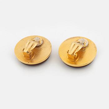 Hermès, a pair of gold tone metal and leather clip-on earrings.