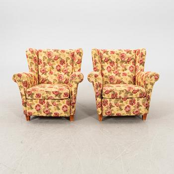 A pair of easy chairs from the middle of the 20th century.