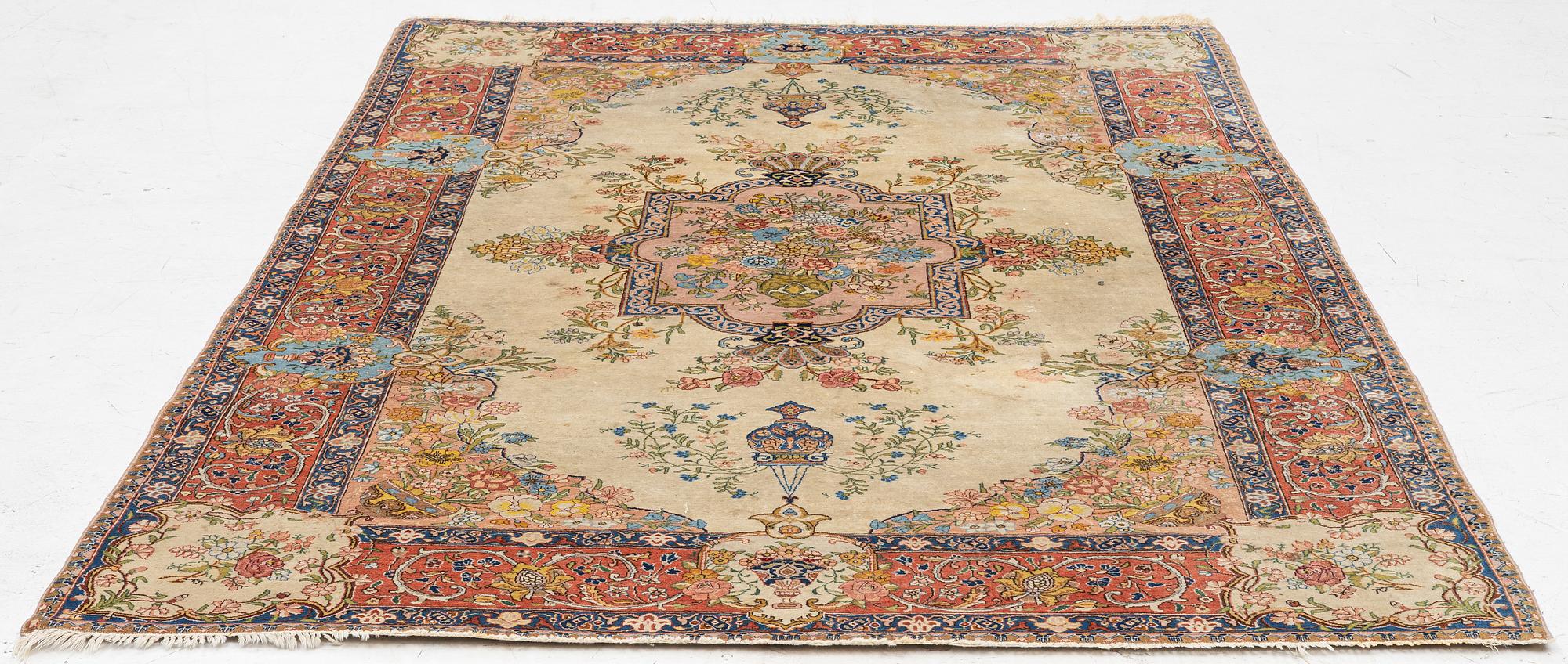 A semi-antique Tabriz carpet, West Persian, c. 250 x 175 cm.
