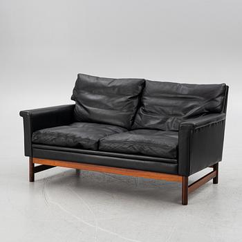 Two leather upholstered sofas and an armchair, IKEA, Sweden, 1960's/70's.