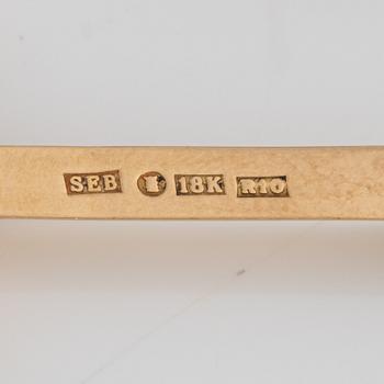 Sebastian Schildt, a pair of earrings, 18K gold with sugilite, tsavorite, and gold diamonds.