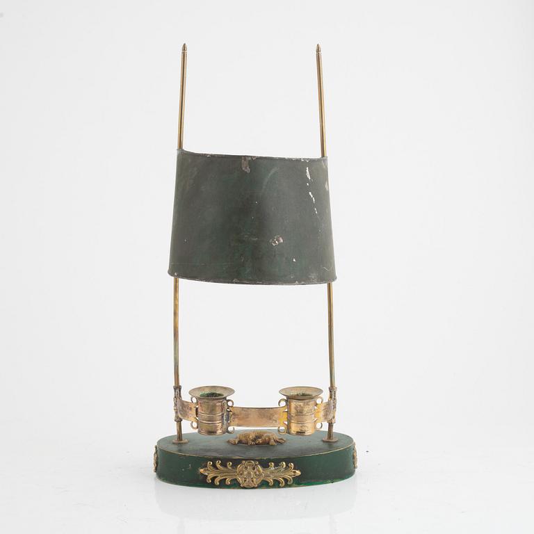 A swedish Empire two-light gilt-brass and tôle-peinte reading lamp, early 19th century.