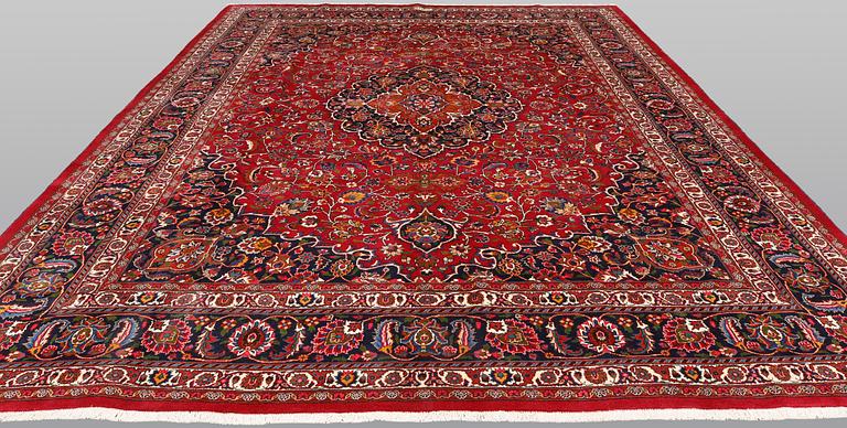 A signed Mashad carpet, ca 375 x 303 cm.