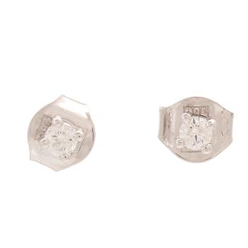 A pair of 18K white gold earrings with round brilliant cut diamonds.