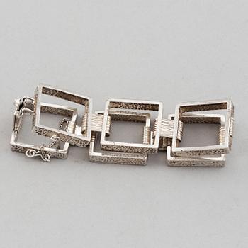 Two silver bracelets, including Denmark.